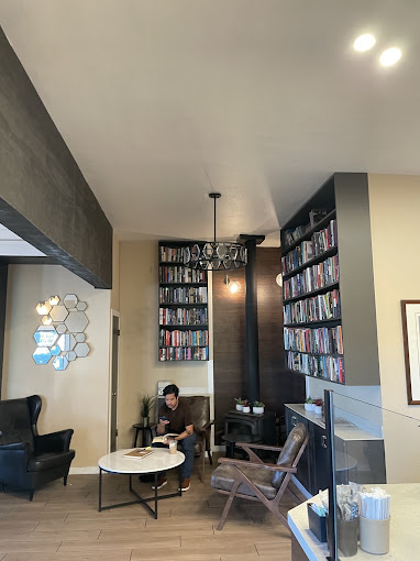 The fireplace reading nook at J.C. Beans, lined with books